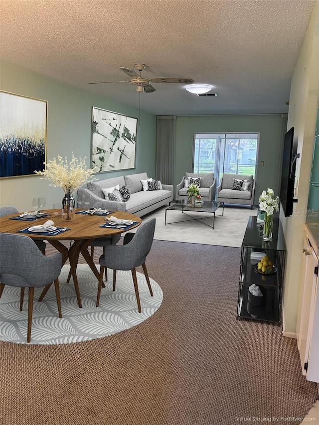 860 Glen More Ct Unit B, Palm Harbor, FL 34684 - carpeted living room featuring ceiling fan and a textured ceiling