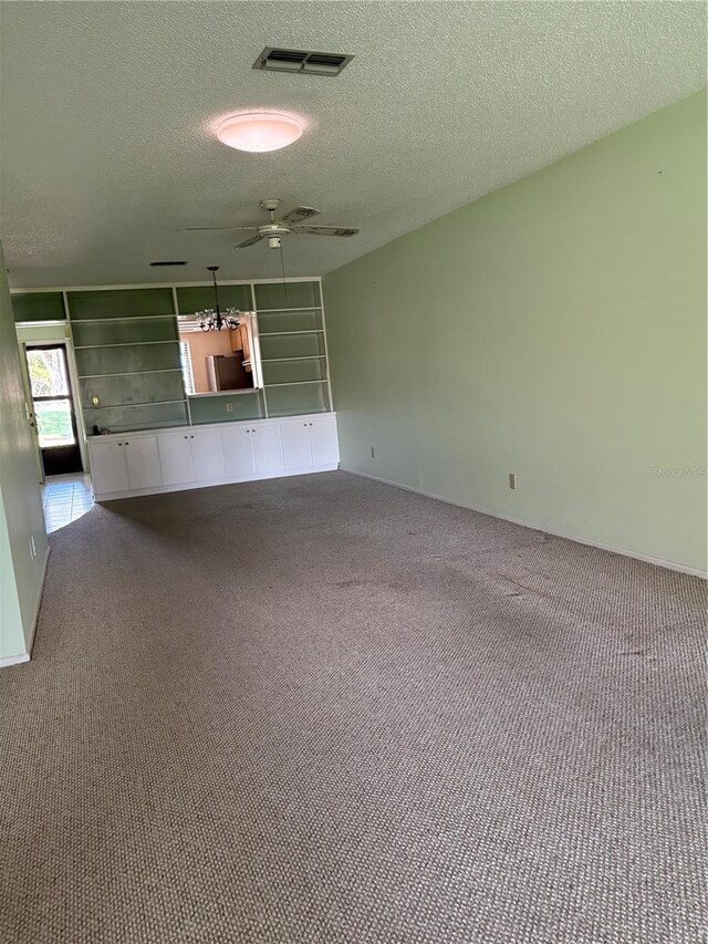 860 Glen More Ct Unit B, Palm Harbor, FL 34684 - carpeted spare room with visible vents, a textured ceiling, and ceiling fan