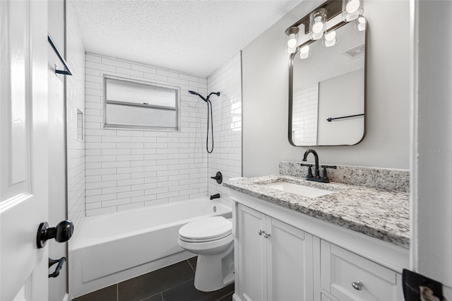 full bath with a textured ceiling, toilet, vanity, visible vents, and tile patterned floors