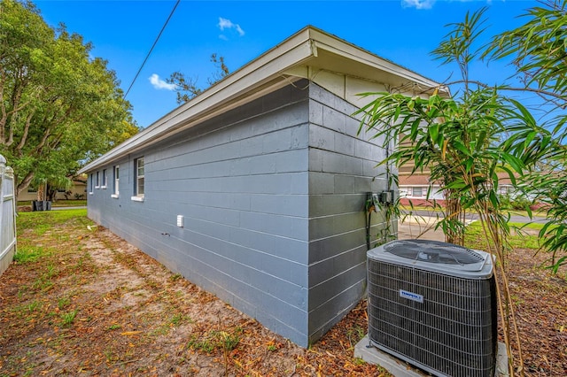 view of side of property with central AC