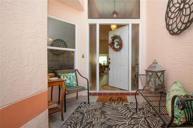 view of exterior entry featuring stucco siding