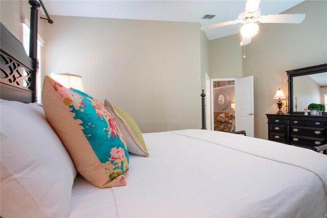 bedroom featuring visible vents, high vaulted ceiling, and a ceiling fan