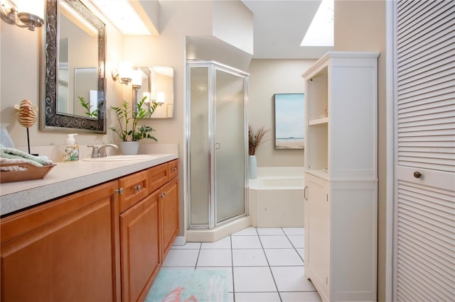 bathroom with a garden tub, a stall shower, a closet, tile patterned flooring, and vanity