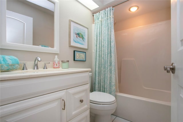 bathroom featuring toilet, shower / tub combo with curtain, vanity, and tile patterned flooring