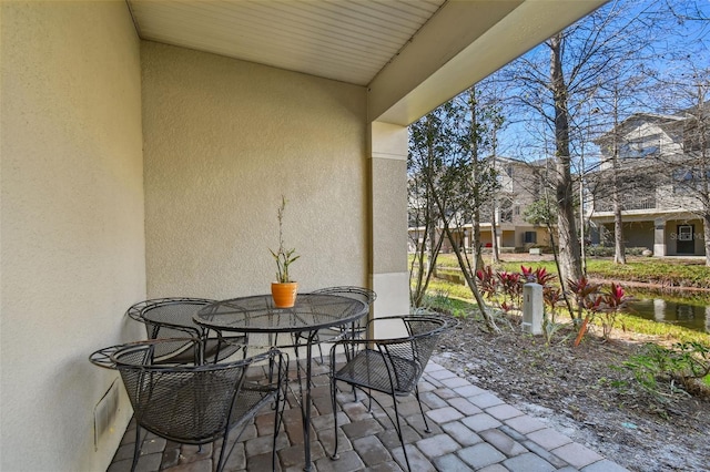 view of patio / terrace with outdoor dining space and visible vents