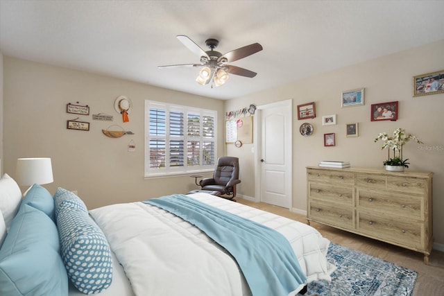 bedroom featuring baseboards and a ceiling fan