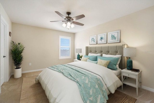 bedroom with carpet, a ceiling fan, and baseboards