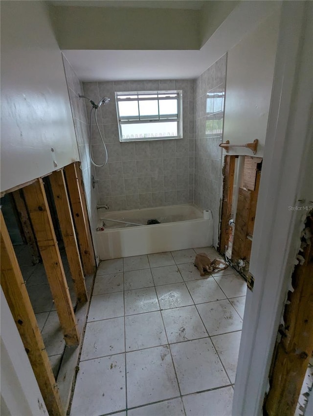 bathroom featuring tile patterned flooring and tub / shower combination