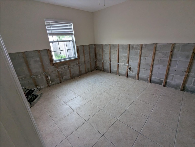 spare room with light tile patterned floors