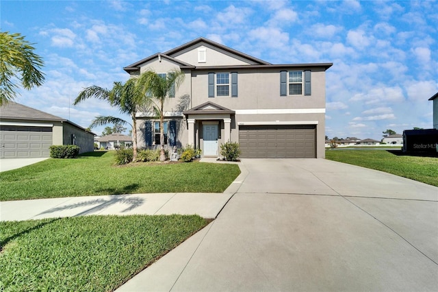 view of front of house with a front yard, a garage, driveway, and stucco siding
