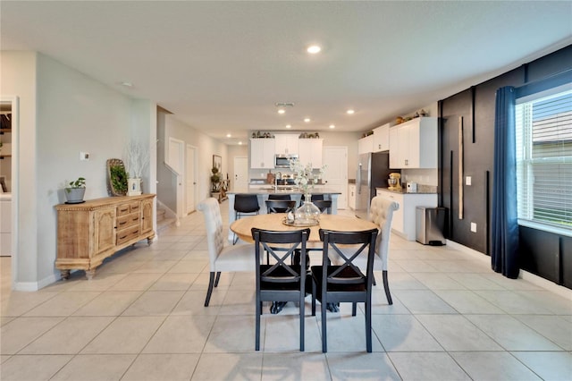 dining space featuring light tile patterned floors, stairs, baseboards, and recessed lighting