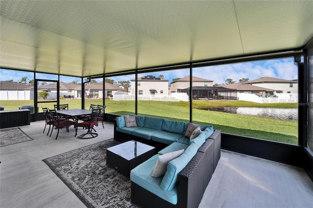 sunroom featuring a residential view