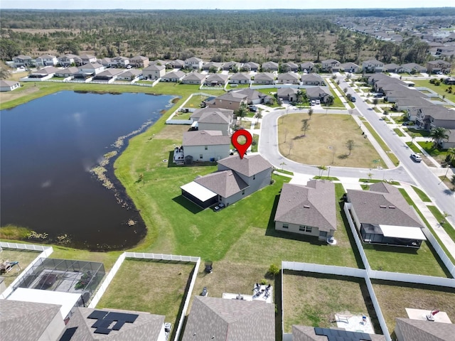 bird's eye view featuring a water view and a residential view