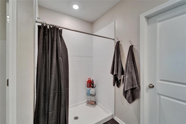 full bath featuring a shower stall