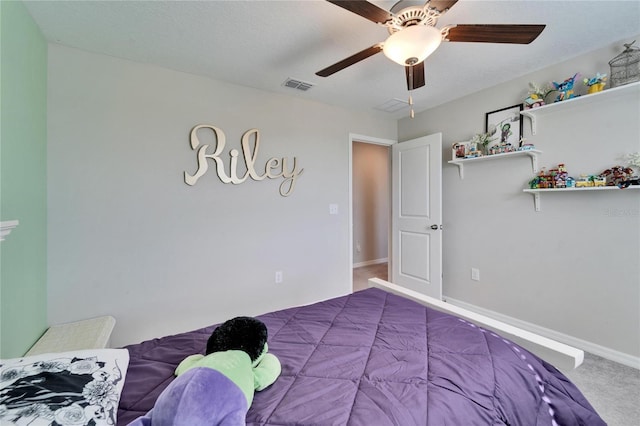 bedroom featuring baseboards, visible vents, carpet floors, ceiling fan, and a textured ceiling