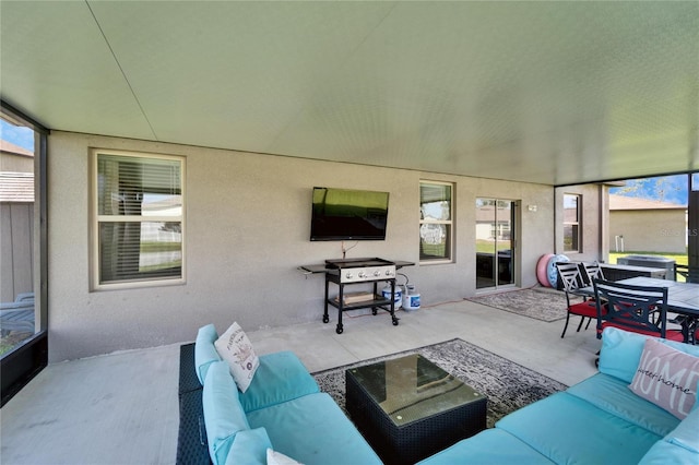 exterior space with outdoor dining area and an outdoor hangout area