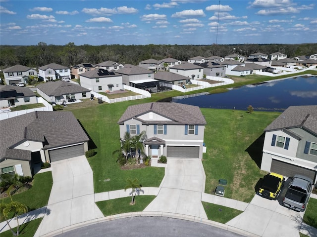bird's eye view featuring a residential view and a water view