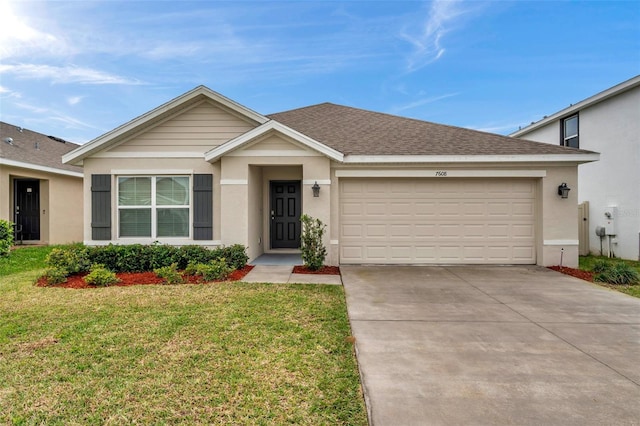 ranch-style house featuring a garage, a shingled roof, driveway, stucco siding, and a front yard