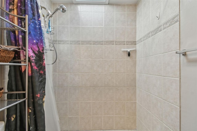 full bathroom with tiled shower