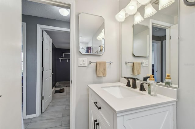 bathroom featuring vanity and a textured ceiling