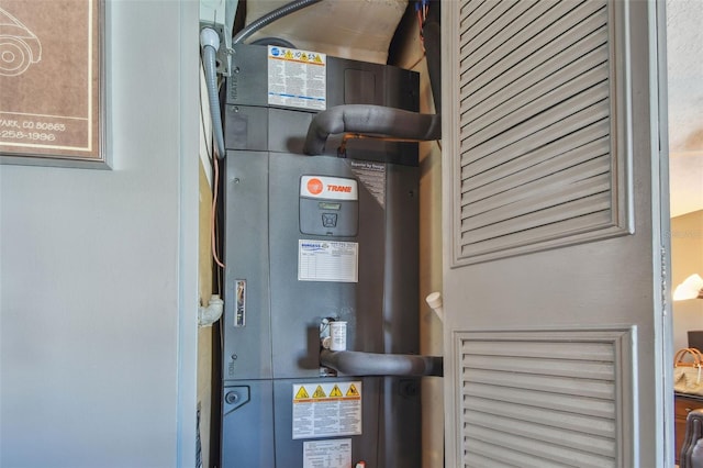 utility room with heating unit