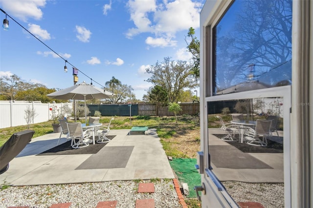 view of patio / terrace with a fenced backyard and outdoor dining space