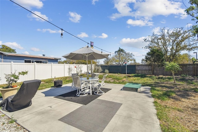 view of patio / terrace featuring outdoor dining space and a fenced backyard