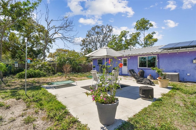 view of patio / terrace featuring cooling unit and fence