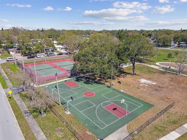 view of basketball court with community basketball court and fence