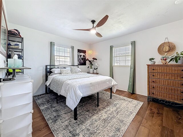 bedroom featuring wood-type flooring and ceiling fan