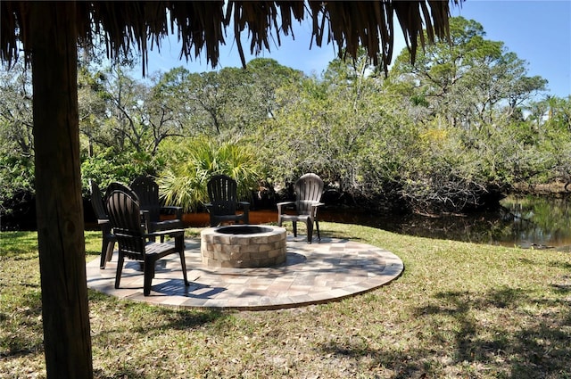 view of yard with a patio and a fire pit