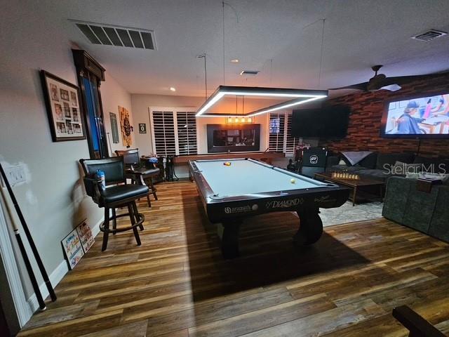 game room with wood finished floors, billiards, and visible vents