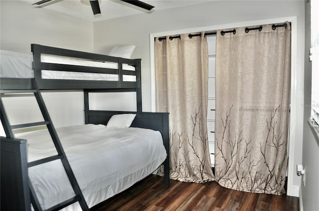 bedroom featuring a ceiling fan and wood finished floors