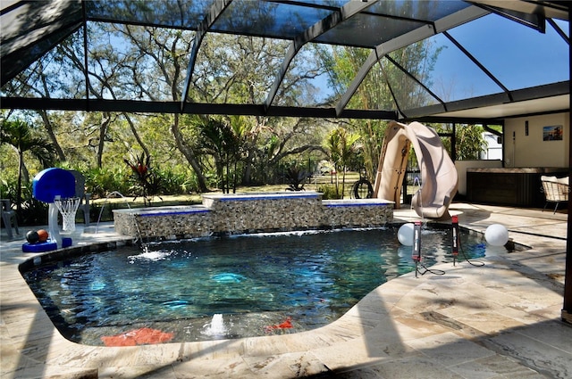 outdoor pool featuring a patio, glass enclosure, and a jacuzzi