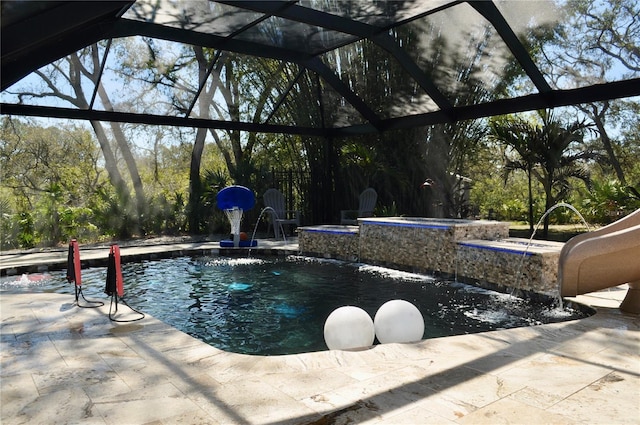 pool featuring a lanai, a patio area, and a jacuzzi