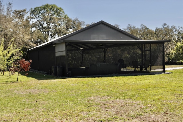 rear view of house featuring a lawn