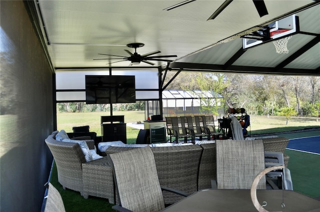 view of patio with a ceiling fan and outdoor dining space