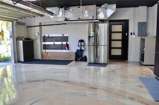 garage with electric panel and stainless steel fridge