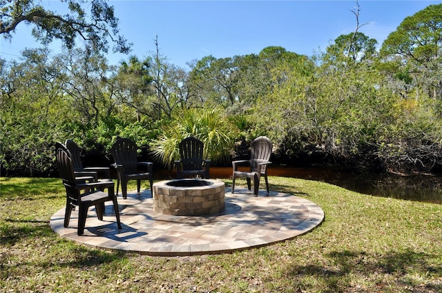 view of patio / terrace with an outdoor fire pit