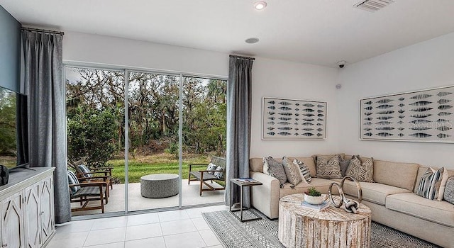 living area featuring recessed lighting, visible vents, and light tile patterned floors