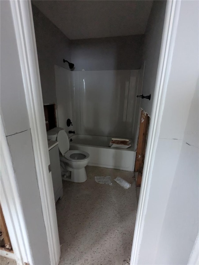 bathroom with shower / washtub combination, vanity, and toilet