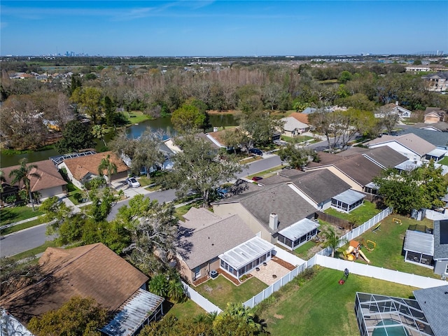 birds eye view of property with a water view and a residential view