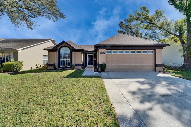 ranch-style house featuring a garage, concrete driveway, a front lawn, and stucco siding