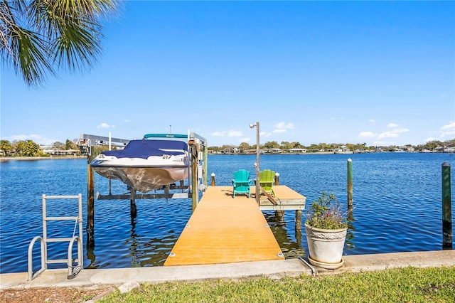 dock area featuring a water view and boat lift