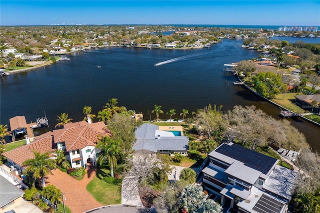 birds eye view of property with a water view and a residential view