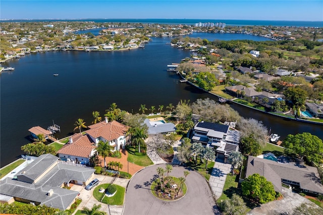 drone / aerial view with a residential view and a water view