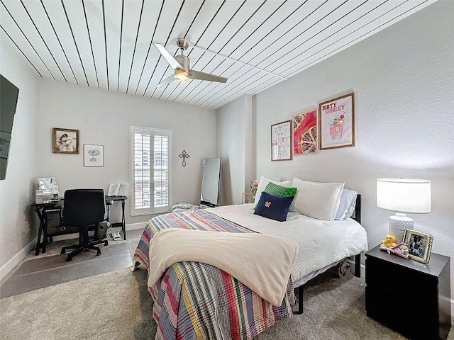 bedroom featuring carpet floors and baseboards