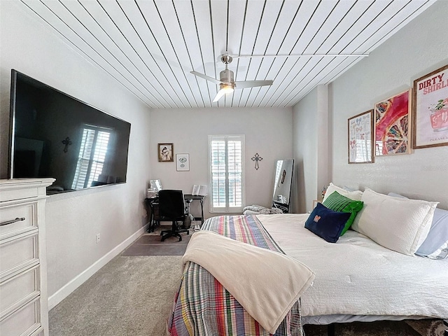 bedroom featuring carpet and baseboards