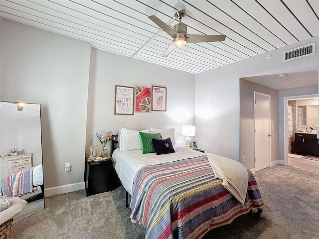 bedroom featuring light carpet, baseboards, visible vents, and a ceiling fan