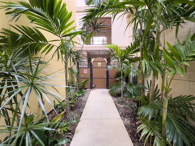 doorway to property with a gate and fence